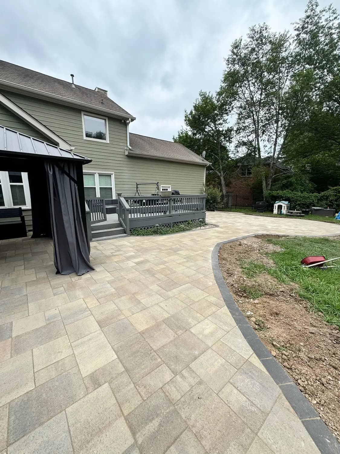 Large paver patio with an integrated walkway